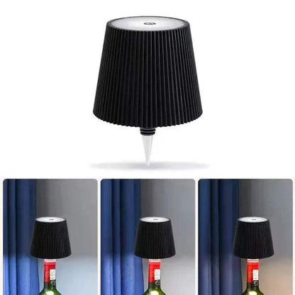 Black pleated LED Bottle Table Lamp  on a white background with three additional images showing its use on a bottle.