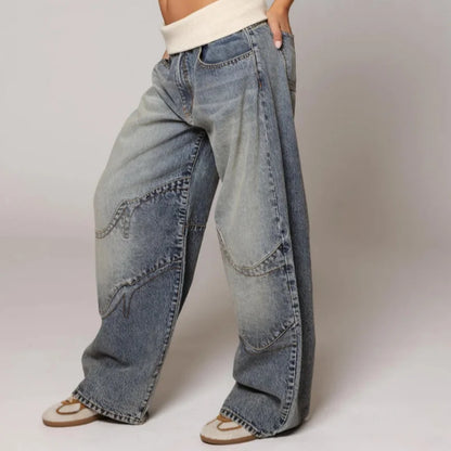 Trendy women's oversized baggy wide leg jeans, featuring a unique ribbed waist and light blue Y2K style.